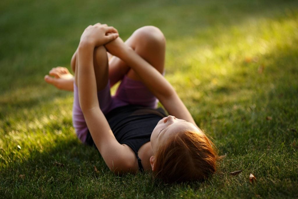 Outdoor activities for kids - rolling down a hill