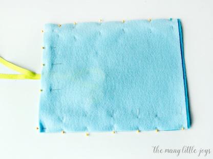 If you're traveling with kids, this travel felt board is a quick DIY craft that makes a great activity for kids stuck on a plane or in a car. It costs less than five dollars, takes less than an hour to make, and will save your sanity when you're on the go with little ones this summer!