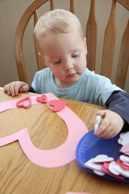 A baby sitting at a table

Description automatically generated with medium confidence