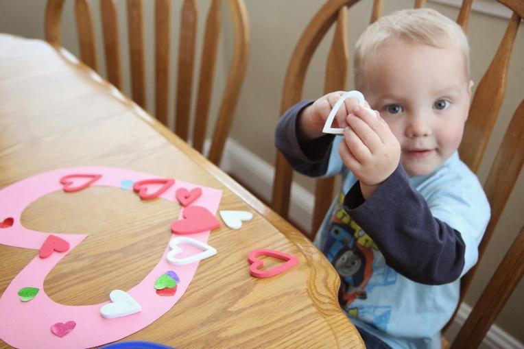 A child sitting at a table

Description automatically generated with medium confidence