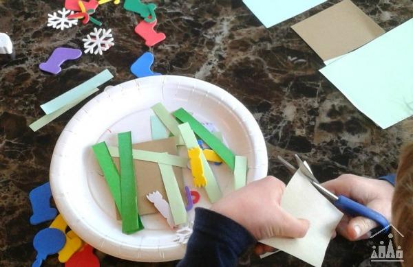 Child making a Christmas Card