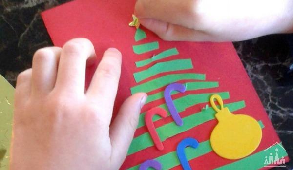 Sticking a star on top of a Christmas Tree Card