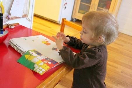 Toddler Making a Sticker Collage