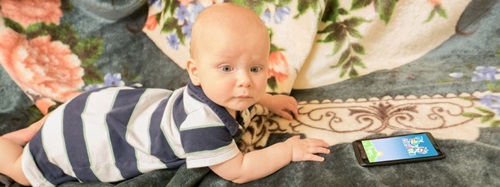 baby by a phone