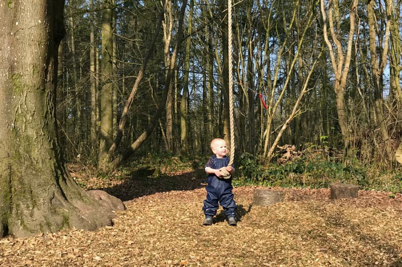 Otto with tree swing at How we Montessori  forest school uk