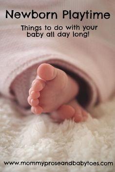 This may contain: a close up of a baby's foot on a blanket