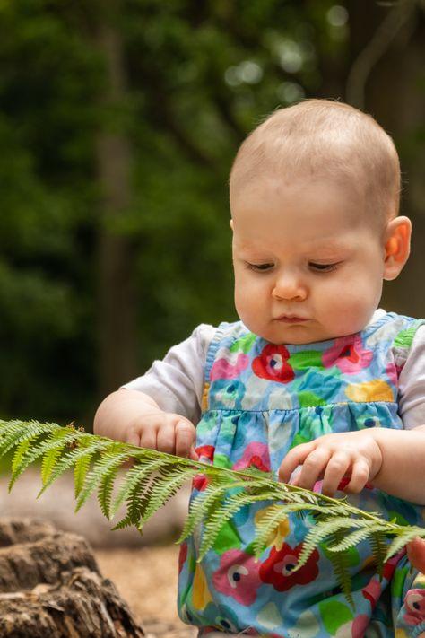 A picture containing person, baby, tree, high

Description automatically generated