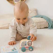 This may contain: four construction trucks made from construction paper on a table